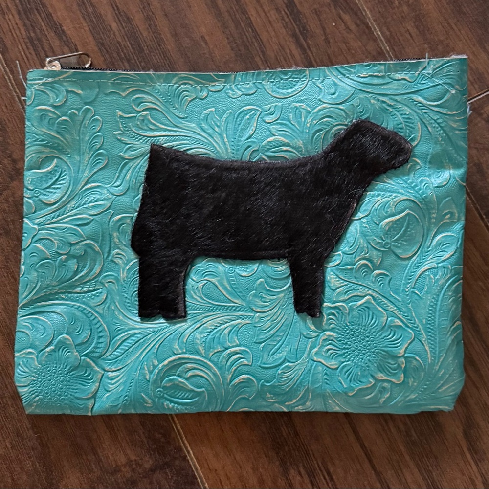 Turquoise Leather Pouch with black cowhide cow.